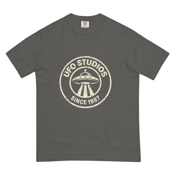 Black heavyweight UFO Studios tee with distressed circular flying saucer seal